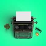 vintage typewriter with hot coffee cup on the color background